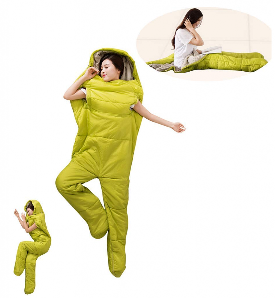 A lady lying down wearing a sleeping bag suit, the suit has legs and spaces for her arms.