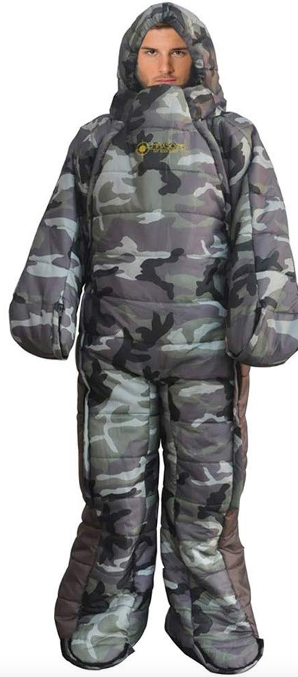 A camouflaged, grey and black sleeping bag with arms and legs, being worn by a man.