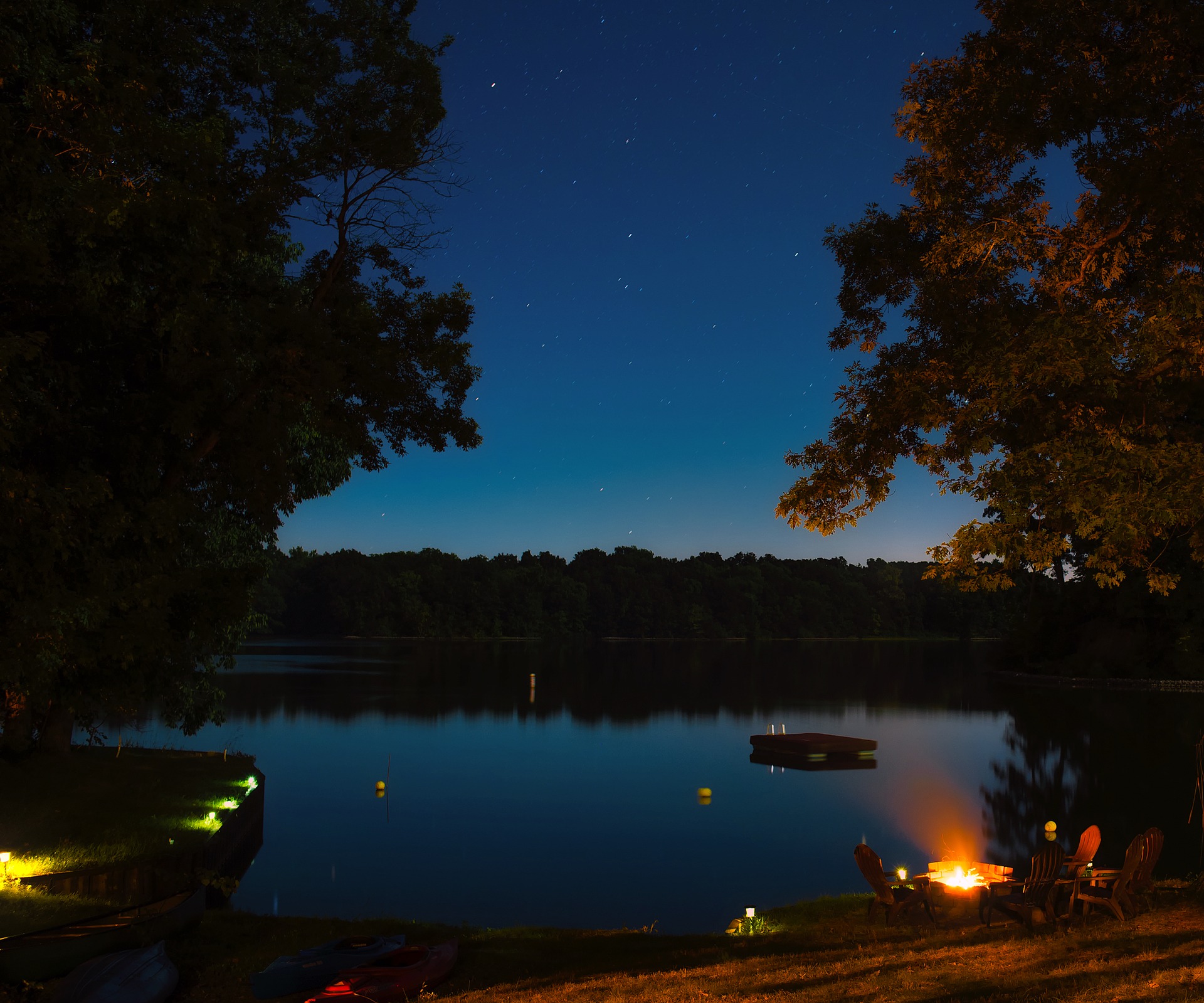 Night time camp fire by a river