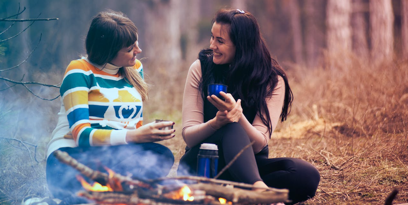 Image of Women Around Campfire