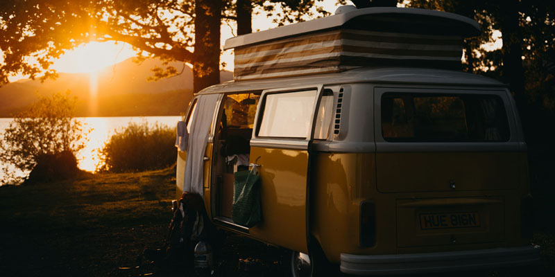 Campervan parked by a lake 
